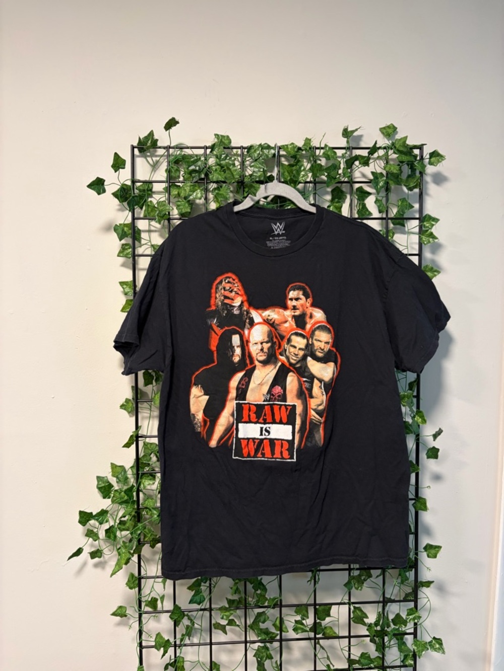 WWE Black Tee with Red and White 'Raw Is War' Group Graphic